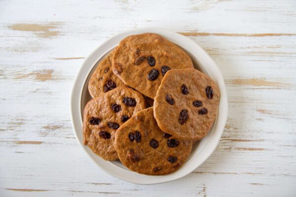 A bowl full of cinnamon raisin protein cookies